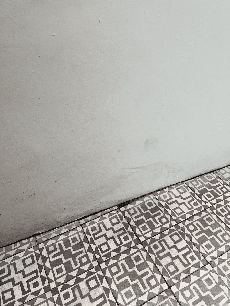 broken tiles eroding from the floor