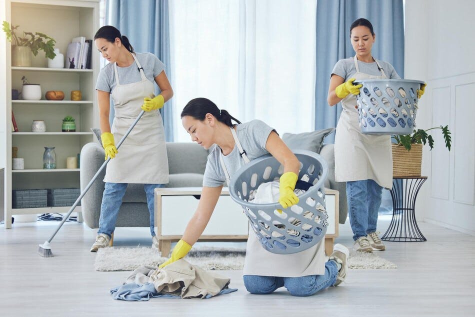 helpers cleaning a home