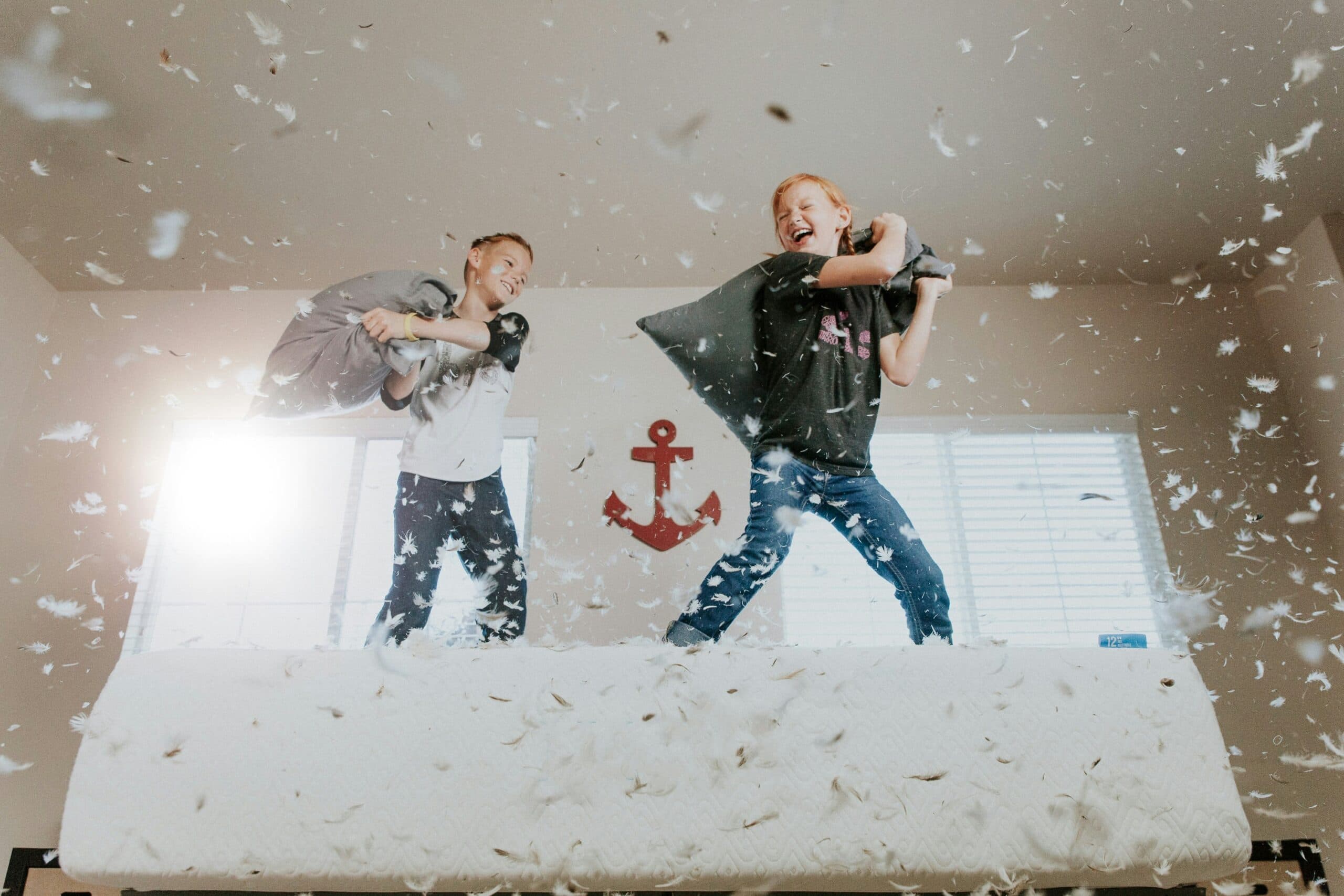 kids playing pillow fight