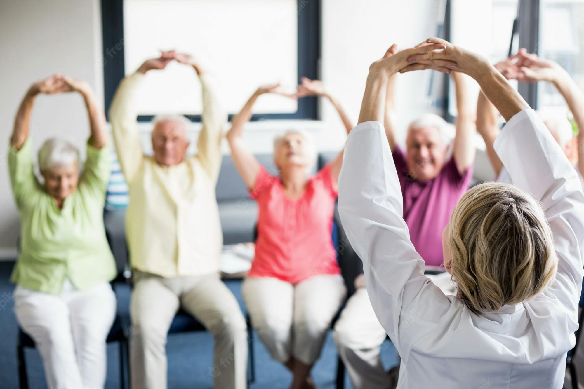 senior citizens doing functional training in a group class