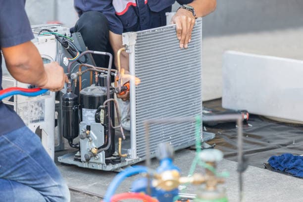 Technician repairing aircon