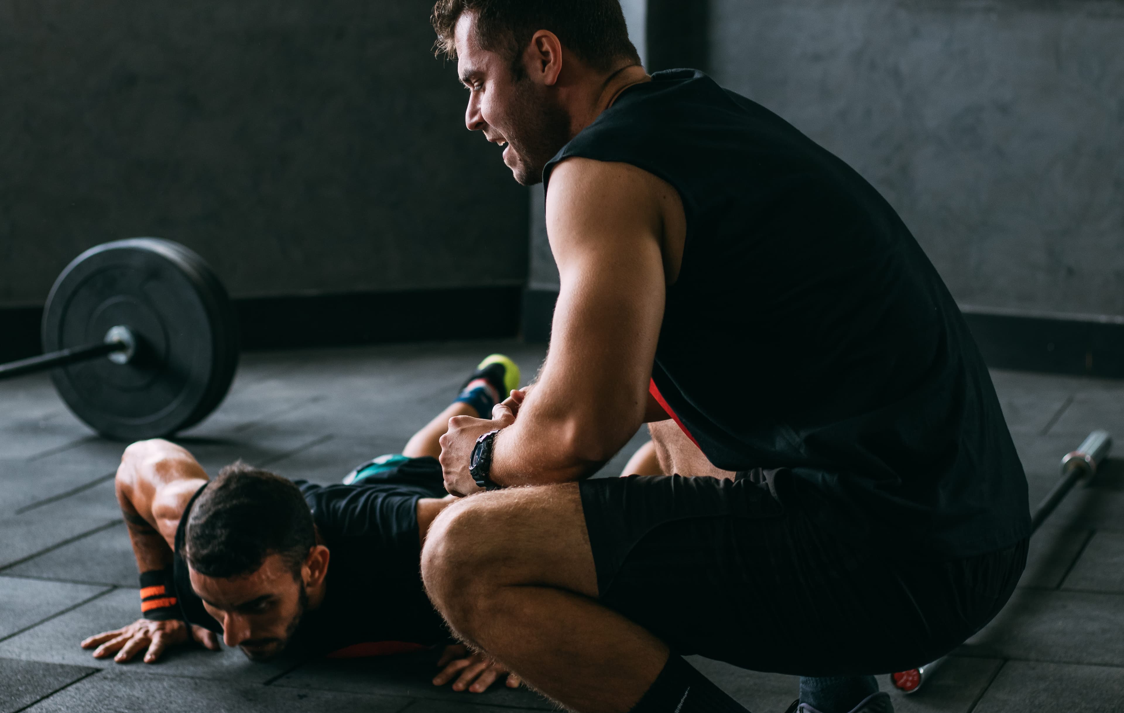 Trainer teaching push ups