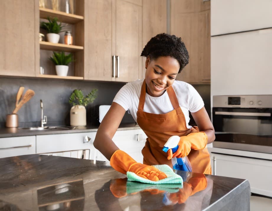 Maid cleaning kitchen